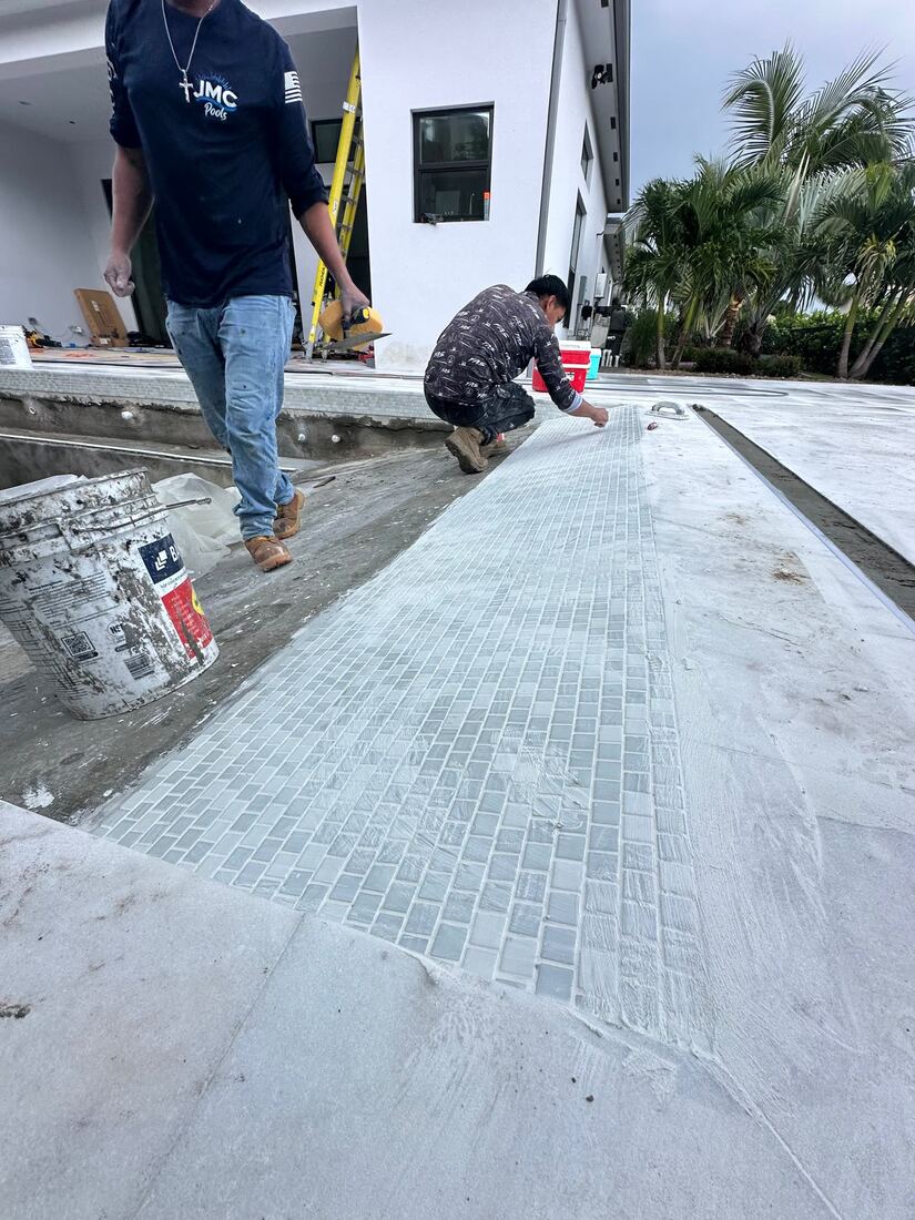 Tile installer at work