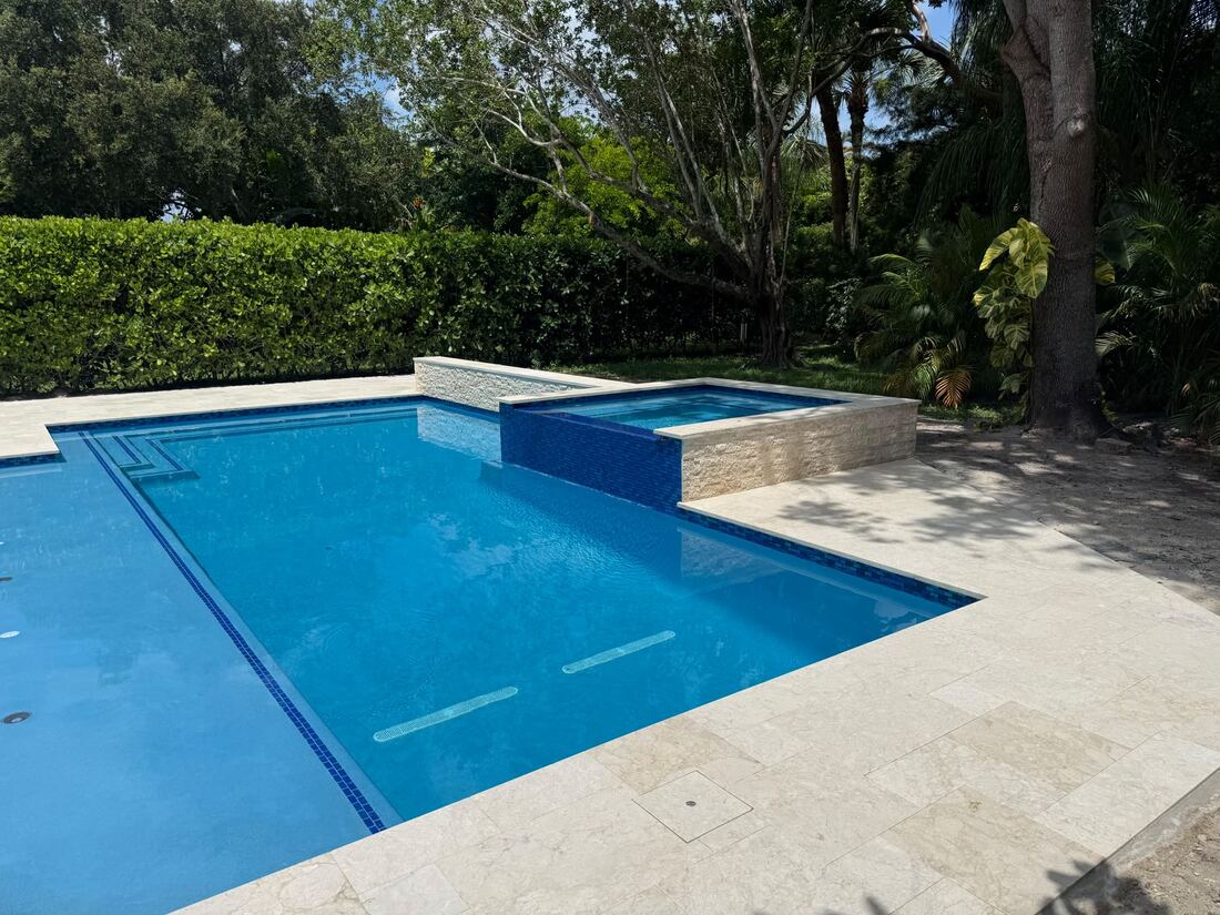 Completed pool with travertine deck